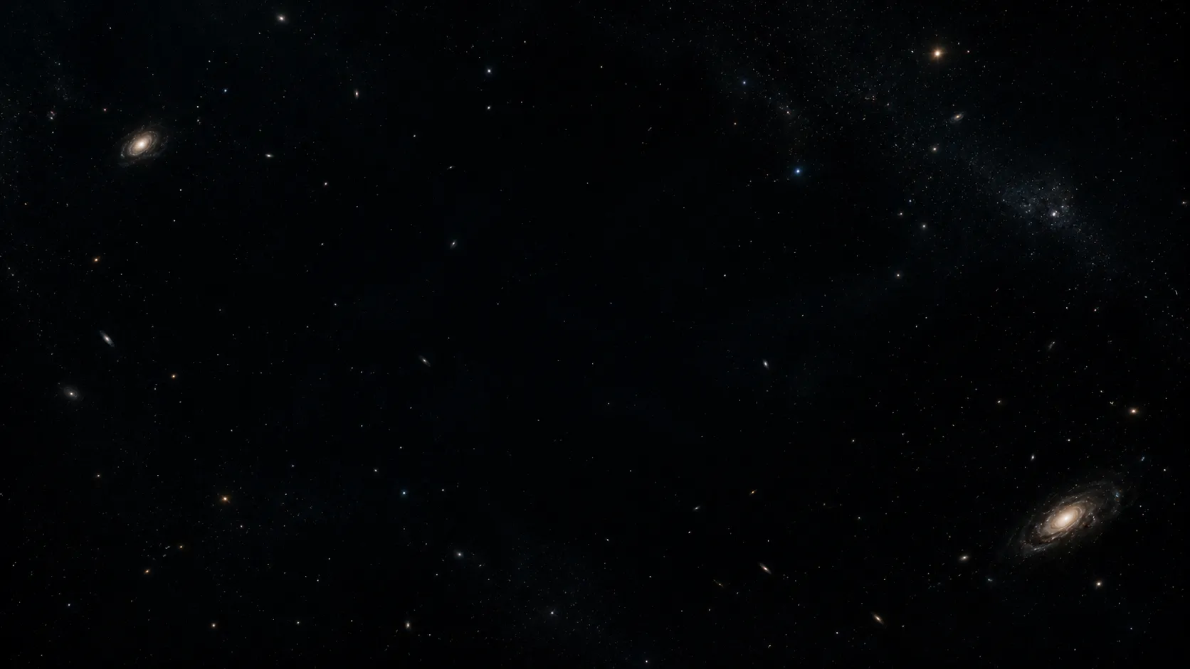 Deep space image showing distant galaxies surrounded by apparent darkness