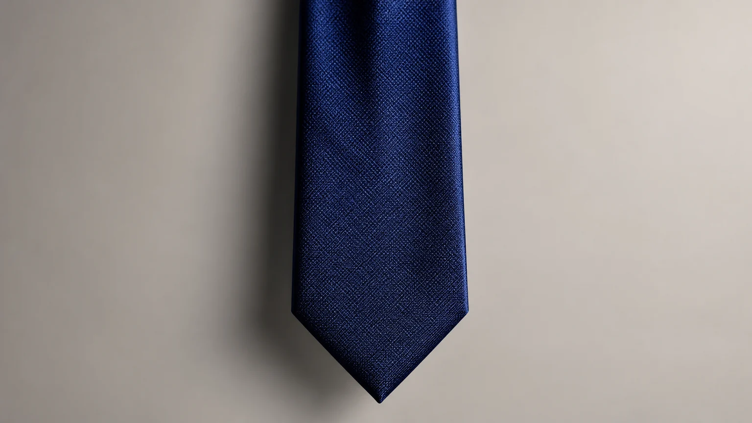Classic necktie showing wider blade tapering to a point at the bottom