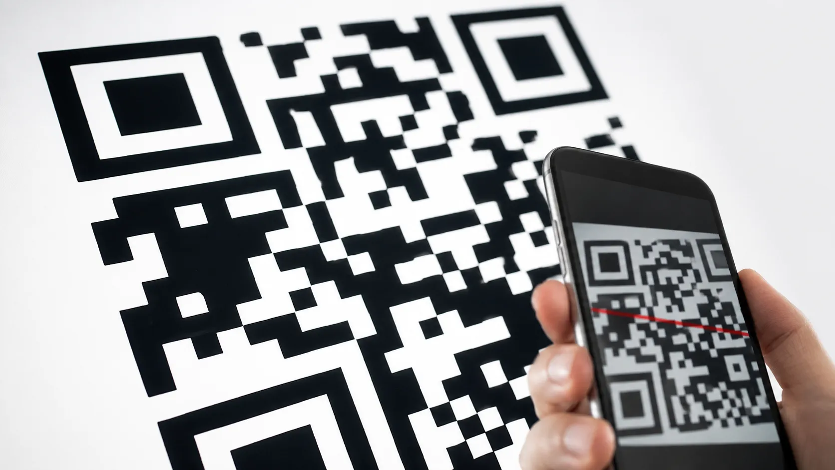 Close-up of a QR code showing three large corner squares
